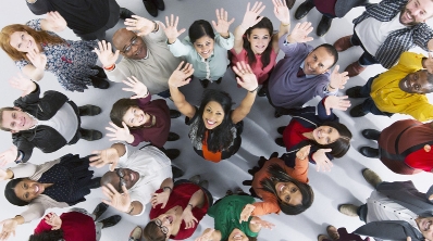 A group of people with their hands in the air, photo is from above